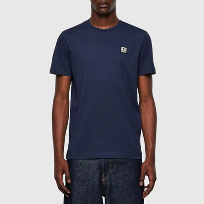 A black man with a diesel t-shirt on white background